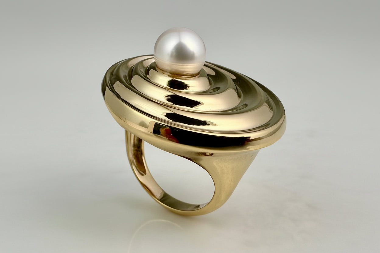 18K Gold plated Sterling silver ring with a white freshwater pearl on a gray background