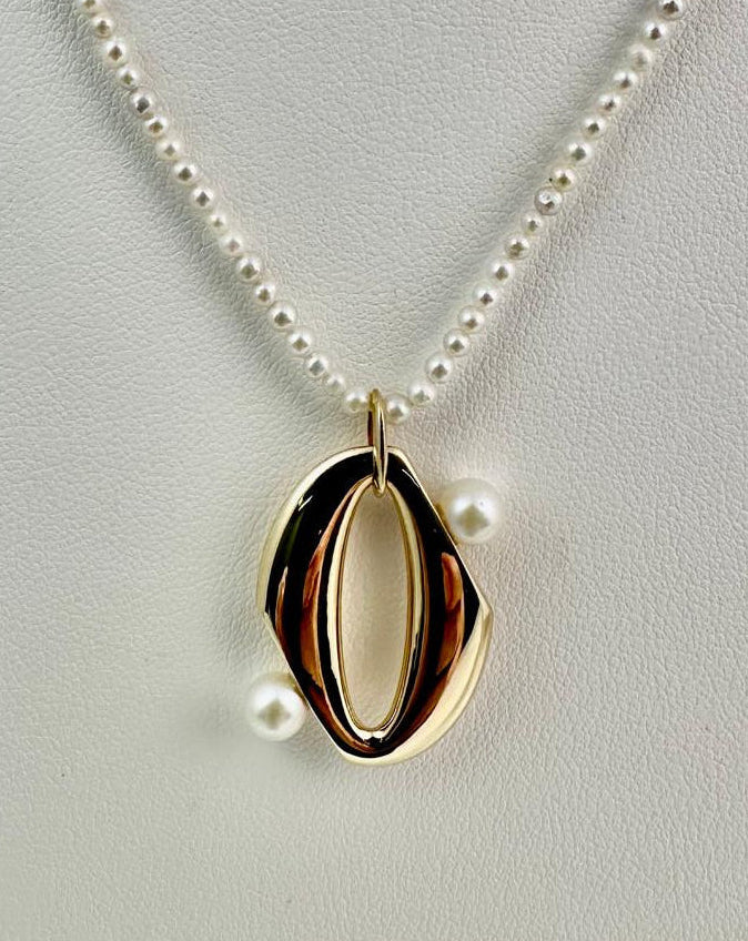 18K Gold plated sterling silver pendant on a white freshwater pearl necklace 