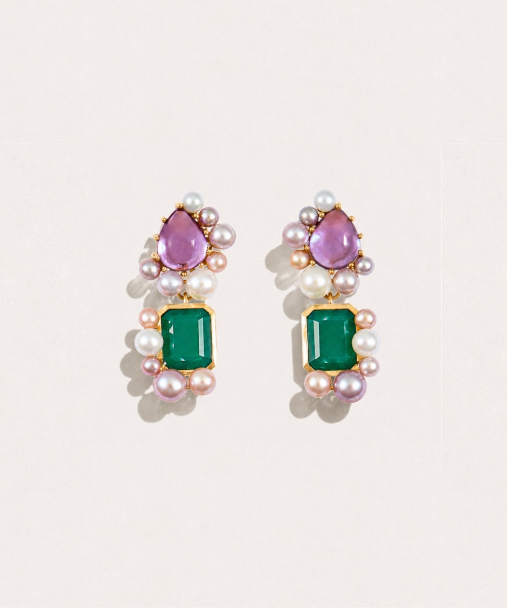 Fierce Pearls Artemisia Cascade Mini Earrings featuring two gemstones, deep green agate and purple amethyst, surrounded by freshwater pearls in a gold-plated silver setting, photographed on a soft cream background.