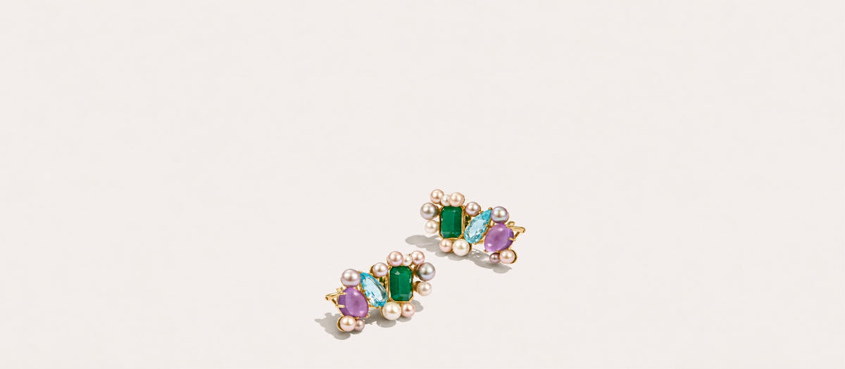 Fierce Pearls Artemisia Ear Climbers in 18K gold-plated finish featuring green agate, sky blue topaz, amethyst gemstones, and clusters of multicolored freshwater pearls.