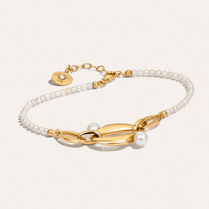 Angled view of the Audrey Swan Bracelet, showcasing white freshwater cultured pearls in 18K gold-plated sterling silver.
