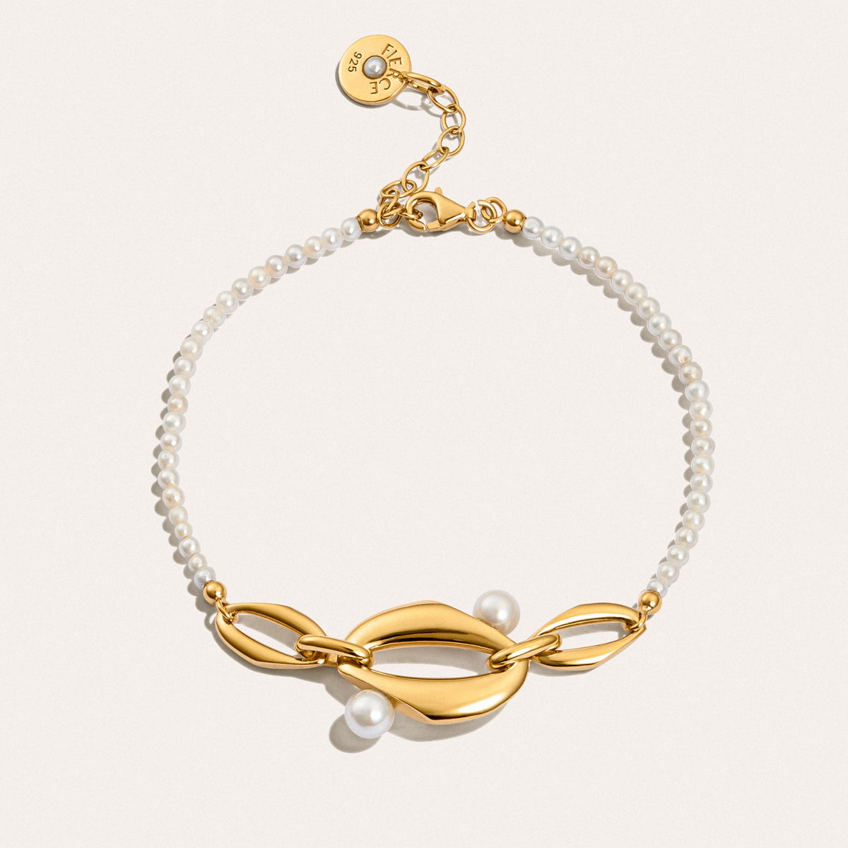 Front view of the Audrey Swan Bracelet in 18K gold-plated sterling silver featuring white freshwater cultured pearls.
