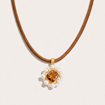 Front view of the Carmen Soul Pendant in 18K gold-plated sterling silver featuring white freshwater cultured pearls and genuine smoky quartz.